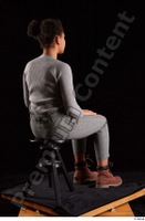  Zahara  1 brown workers dressed grey sweatshirt grey trousers sitting whole body 0004.jpg